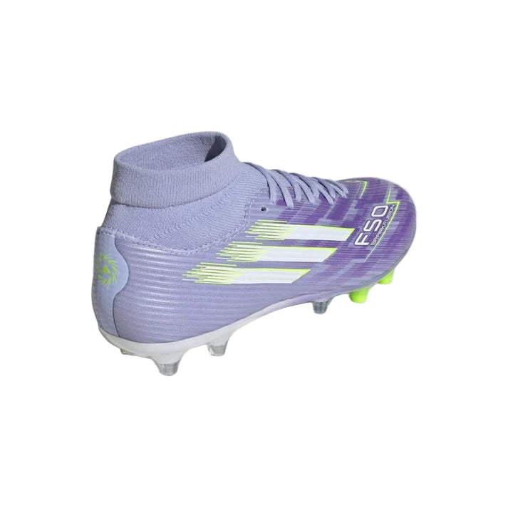 Purple soccer cleat with green accents on a light gray background